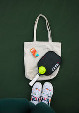 Tote bag with Sunii Energy Gum and sports gear, emphasizing portability and active lifestyle